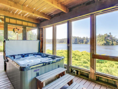 Hot tub on lower deck with view towards Floras Lake